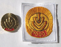 Picture of the pin and patch for 1,000 Events