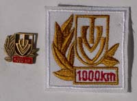 Picture of the pin and patch for 1,000 Kilometers