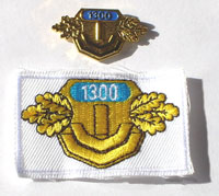 Picture of the pin and patch for 1,300 Events